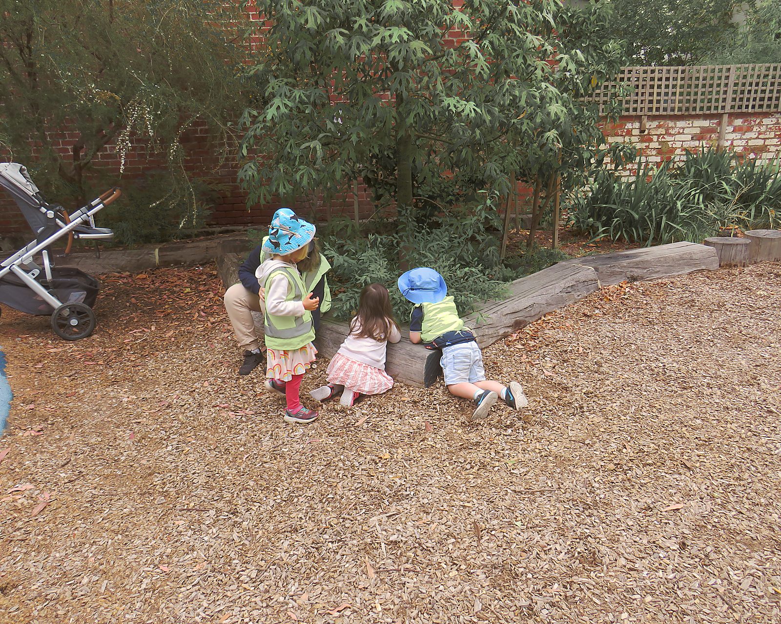 Children walking together on a Kinderclub excursion, exploring the world beyond the gate